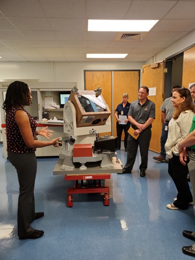 Project Scientist Yolanda Shea discusses the CLARREO Pathfinder mission using the team's 3D model during NASA Earth Science Division Director Karen St. Germain's visit to NASA LaRC.