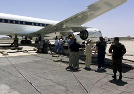 Experimenters preparing to sample the exhaust of the NASA DC-8 engines.